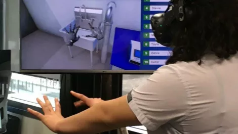A hamilton girls  high school student washes her hands in a virtual reality dairy shed