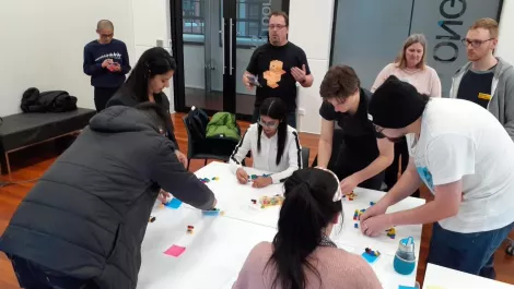 The gig interns having a brainstorming session with lego